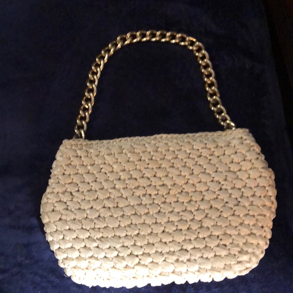 Off white handmade straw bag w/gold chain strap.